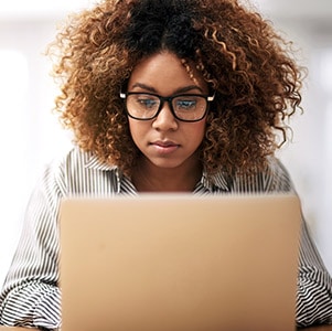 Woman in front of laptop