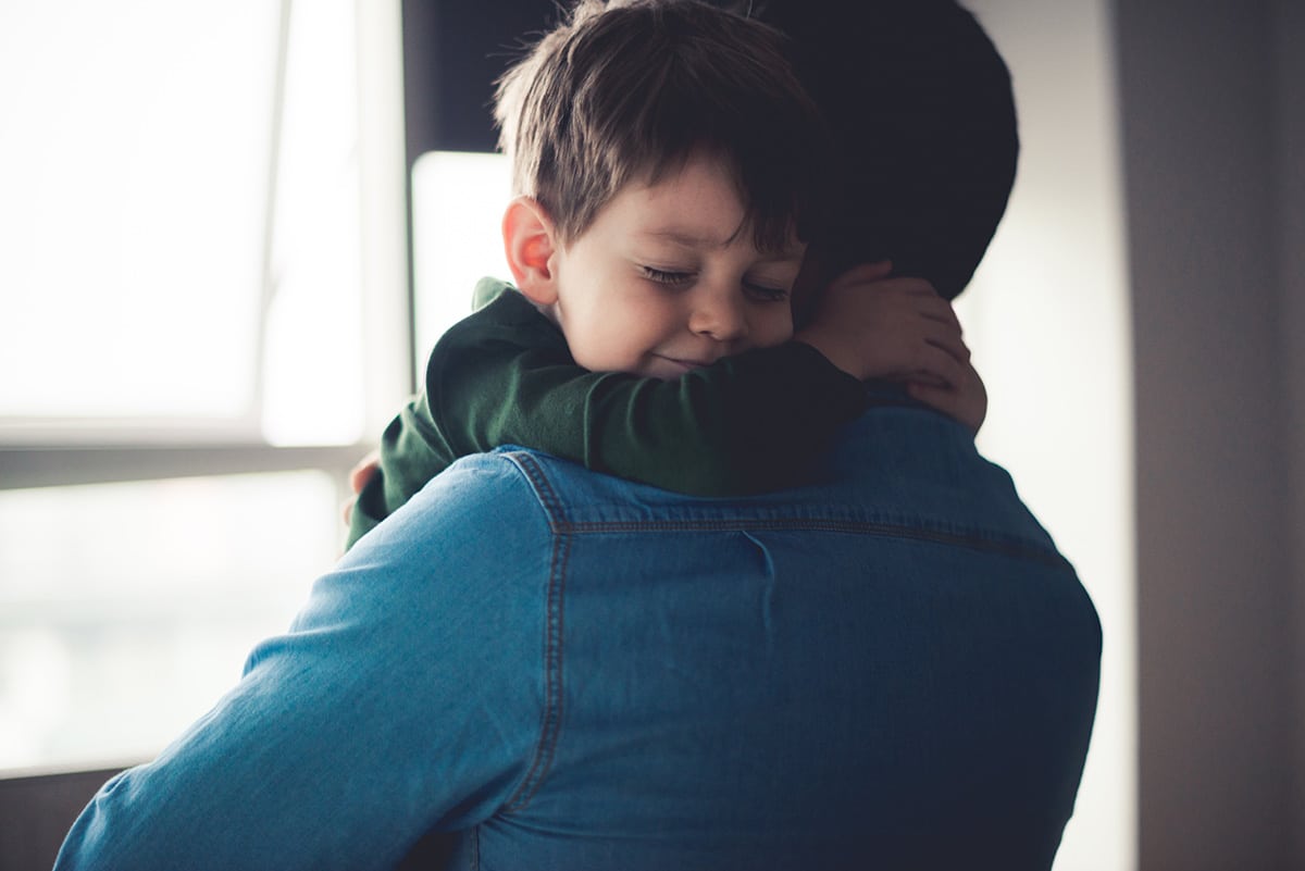 Father holding son