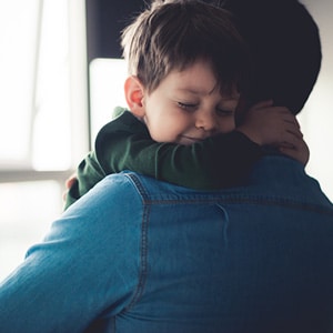 Father holding son
