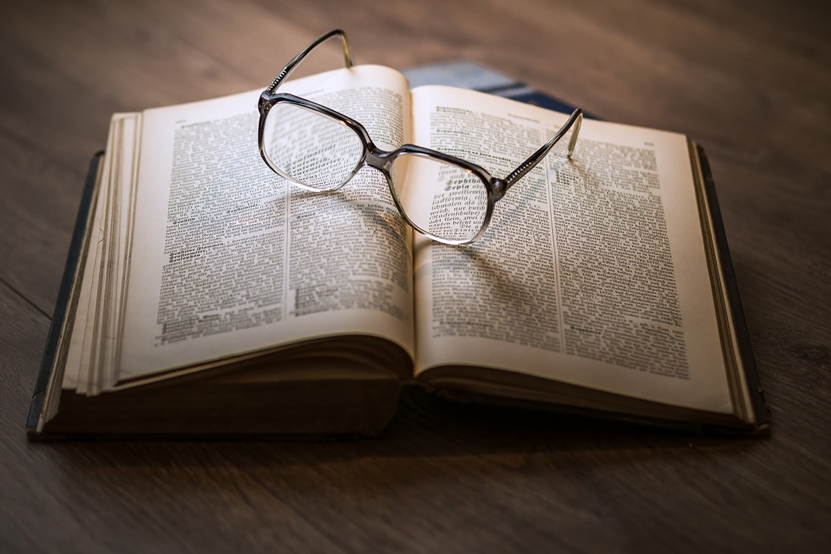Book with glasses.