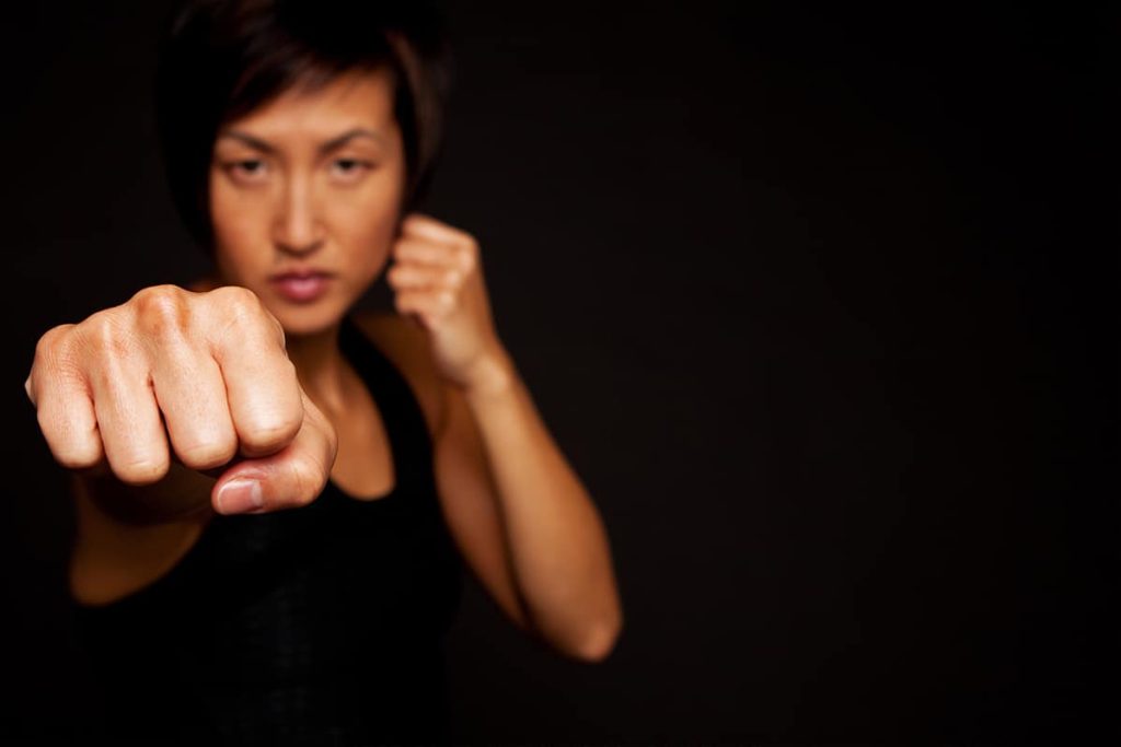 A woman in a self-defense position.