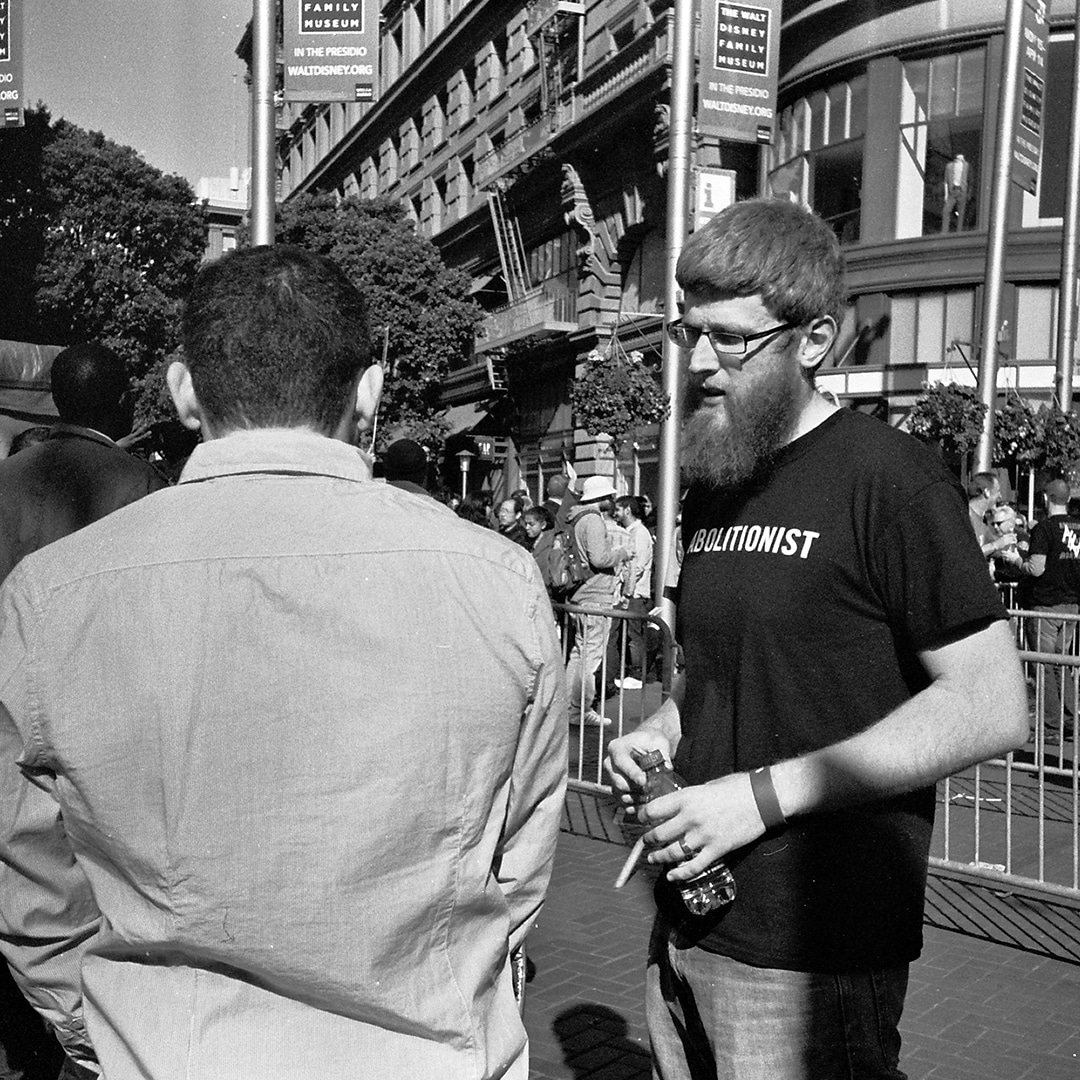 Abortion abolitionist man talking to another man