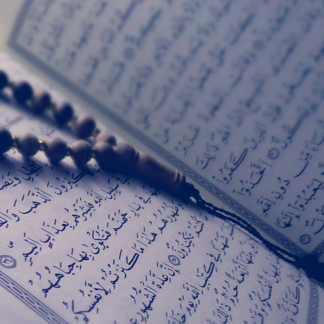 Quran with prayer beads