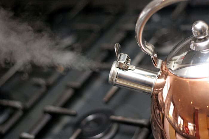 Boiling tea kettle with steam