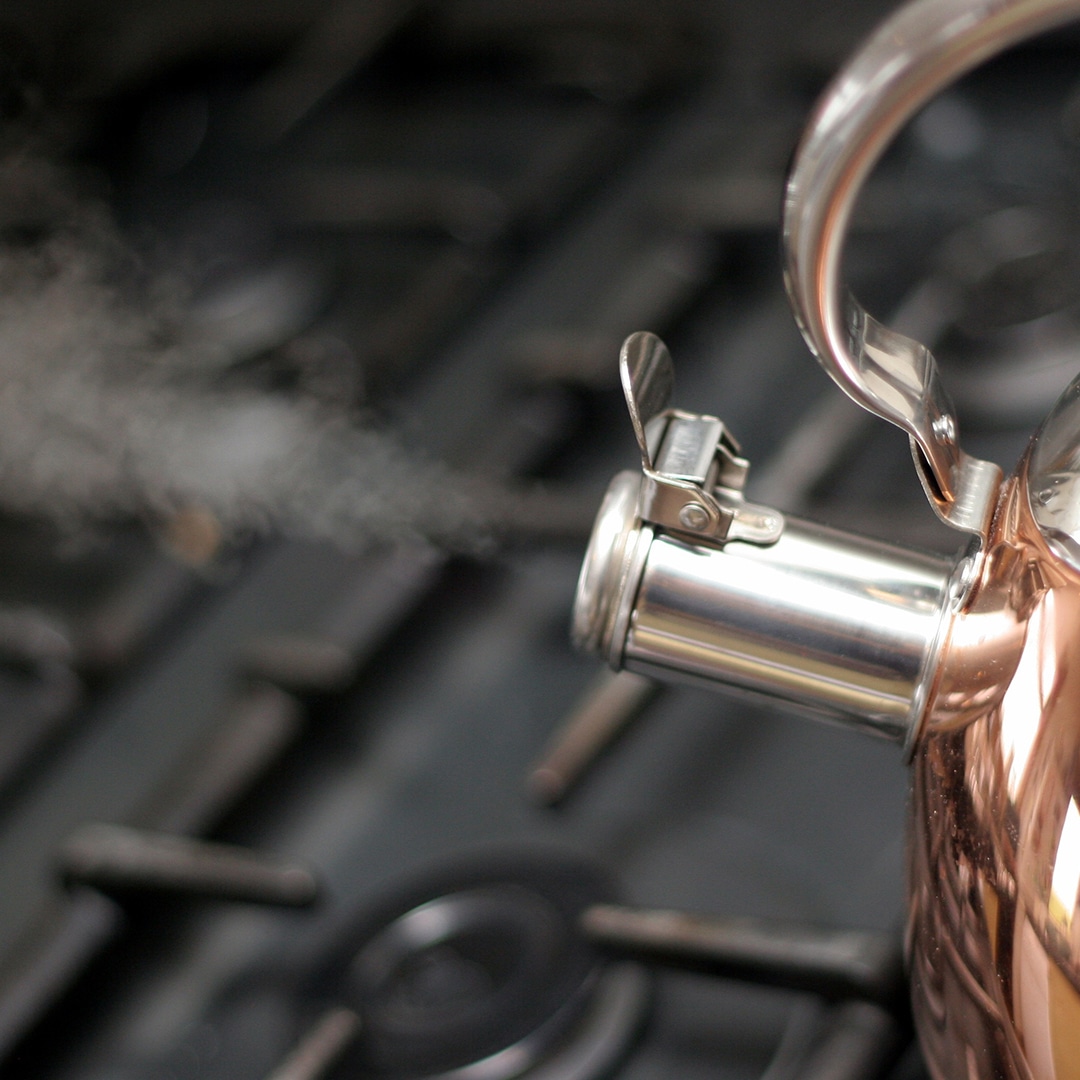 Boiling tea kettle with steam
