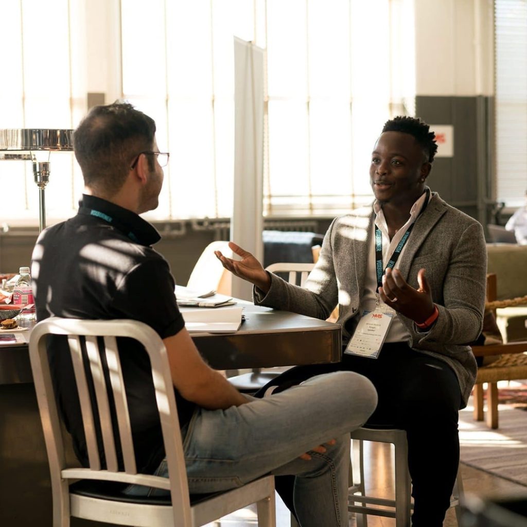 Black man and white man talking